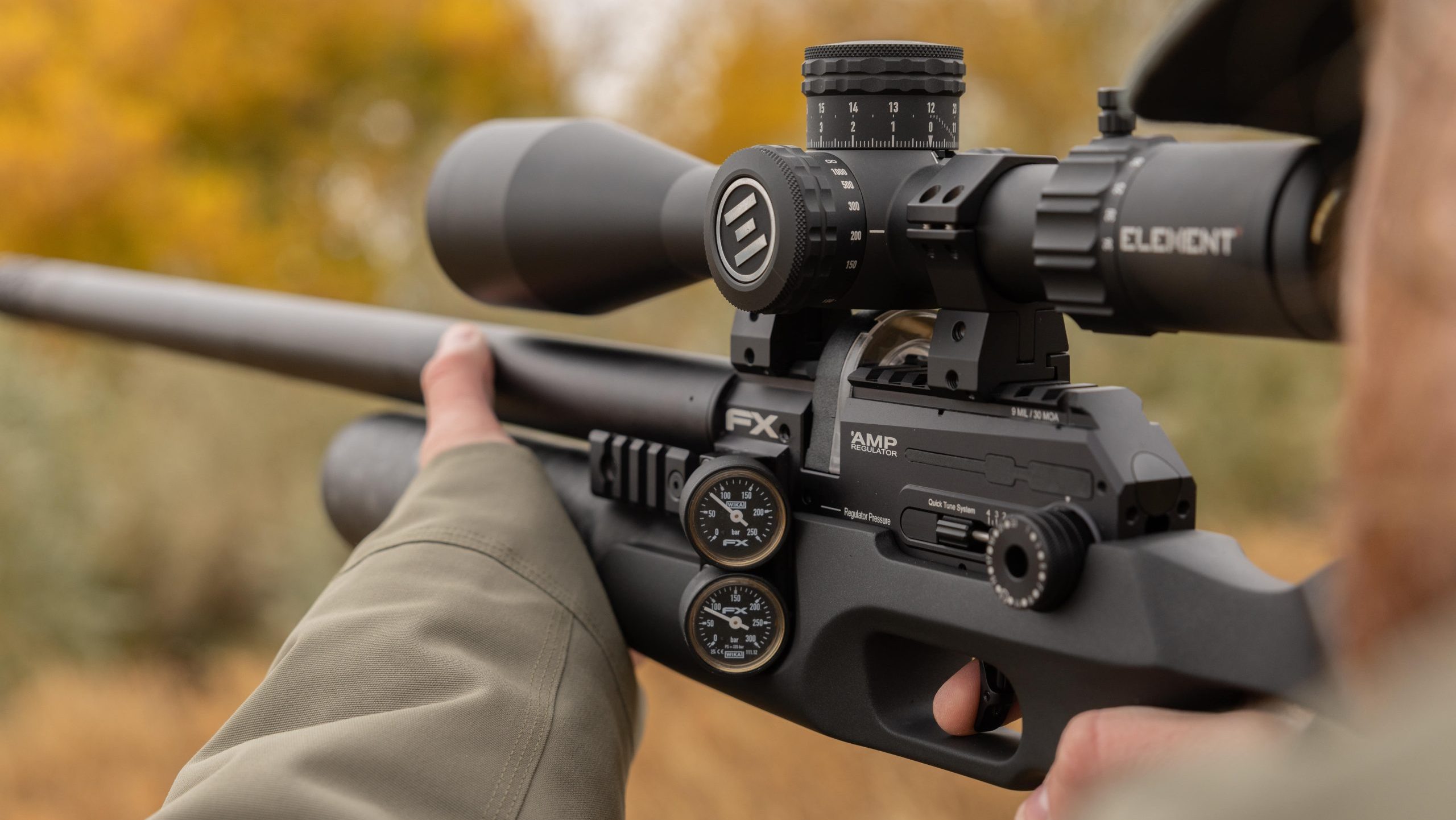 An air rifle being held by a man