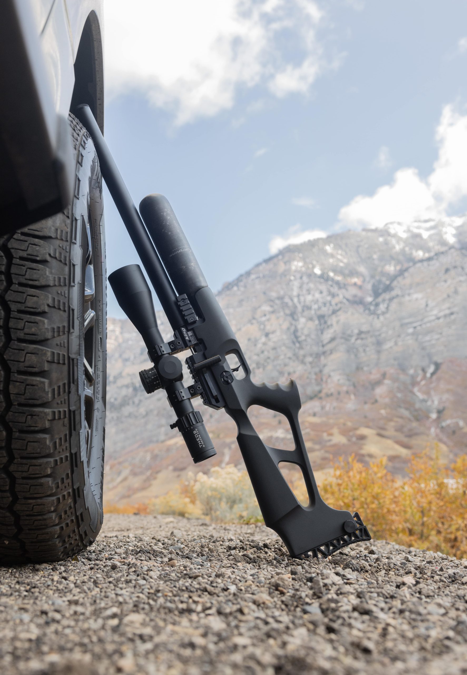 Air rifle leaning against a tyre