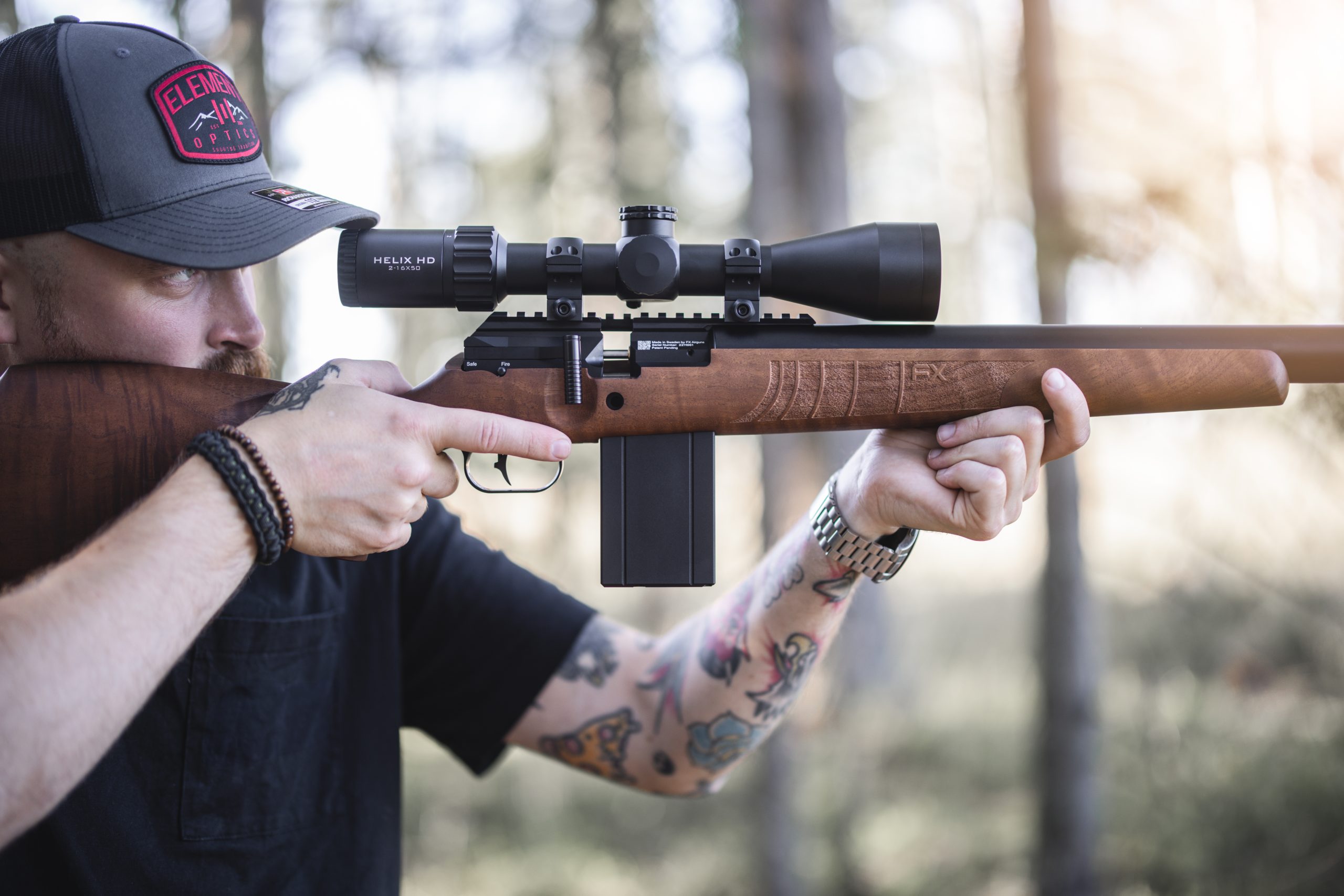 Man looking through the scope of an air rifle