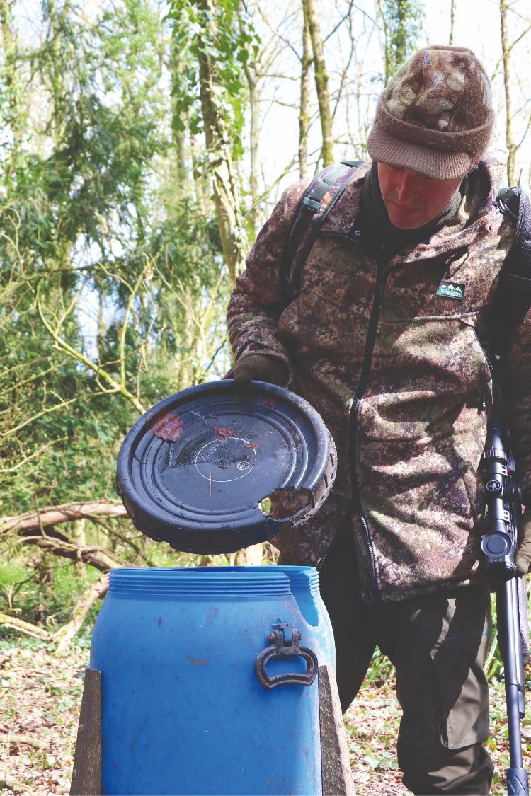 Mat Manning checking a pheasant feeder