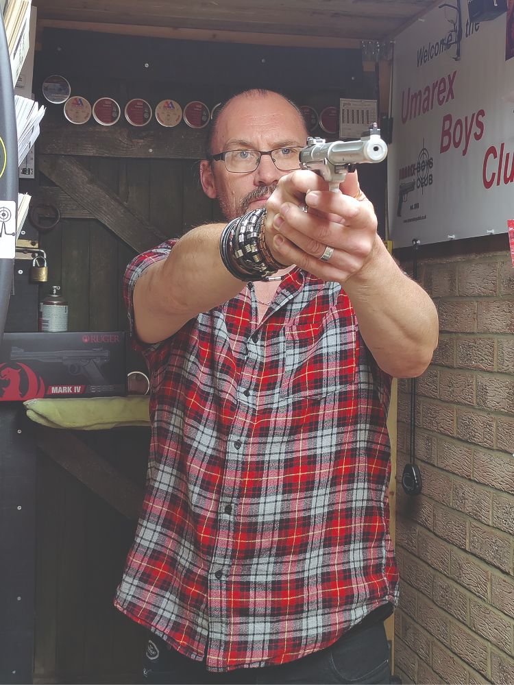 man with pistol 