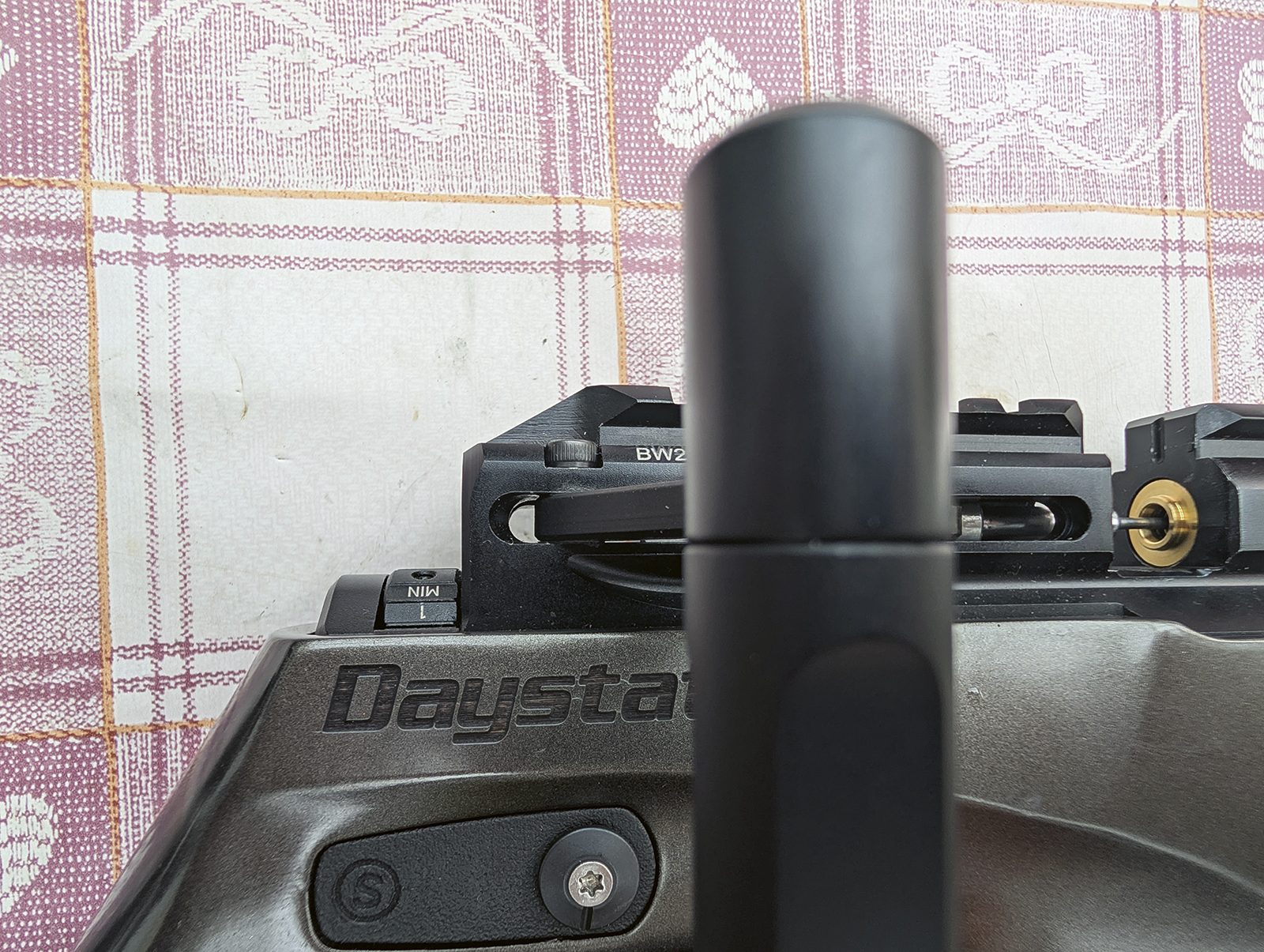 Daystate Blackwolf half-cocked with a dowel pushing the side plate free through the gap