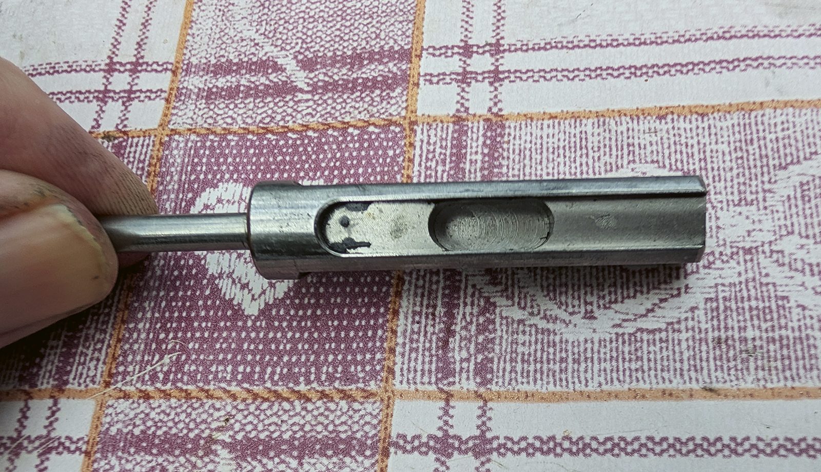 Removed Daystate Blackwolf pellet probe held in hand before lubricating with moly