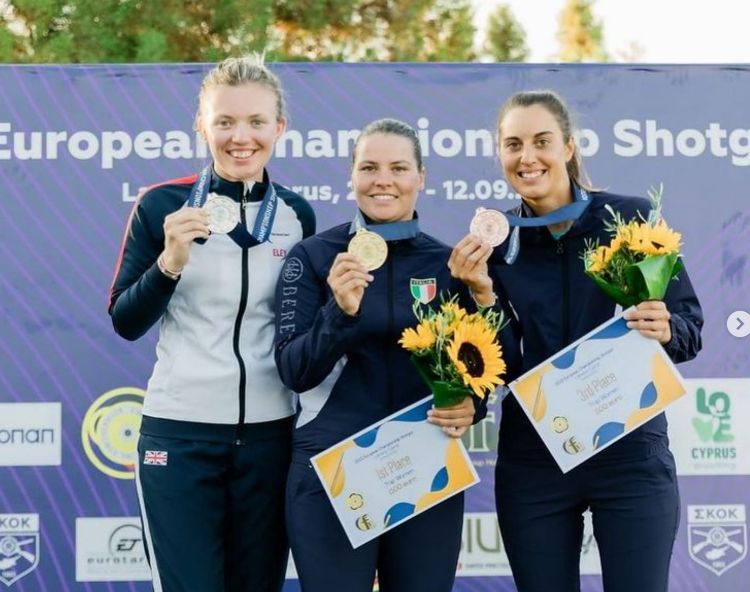 Lucy Hall on the podium after winning silver